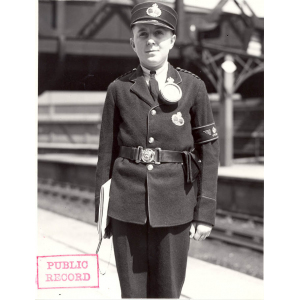 Boy messenger with illuminated badge at Paddington Station 1935